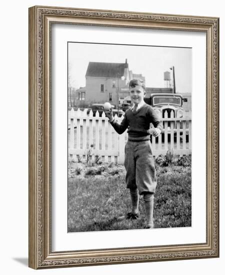 Young Boy Tosses a Baseball in His Backyard, Ca. 1936.-Kirn Vintage Stock-Framed Photographic Print