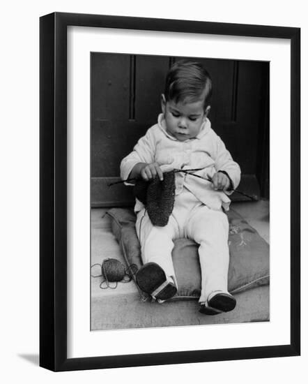 Young Boy Trying to Use Knitting Needles During Drive to Provide Woolen Goods for Servicemen-null-Framed Photographic Print