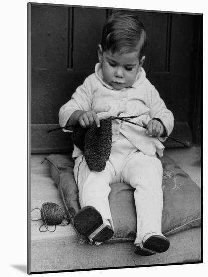 Young Boy Trying to Use Knitting Needles During Drive to Provide Woolen Goods for Servicemen-null-Mounted Photographic Print