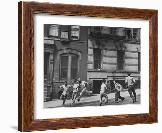 Young Boys with Sticks, Running Around While Playing a Street Game in Spanish Harlem-Ralph Morse-Framed Photographic Print