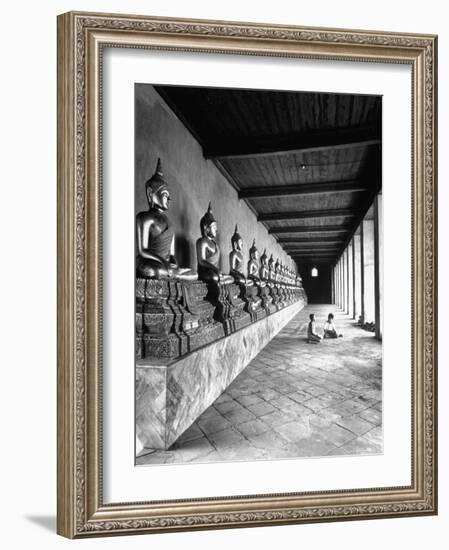 Young Buddhist and Boy on Inner Courtyard Near Buddhist Shrine-Dmitri Kessel-Framed Photographic Print