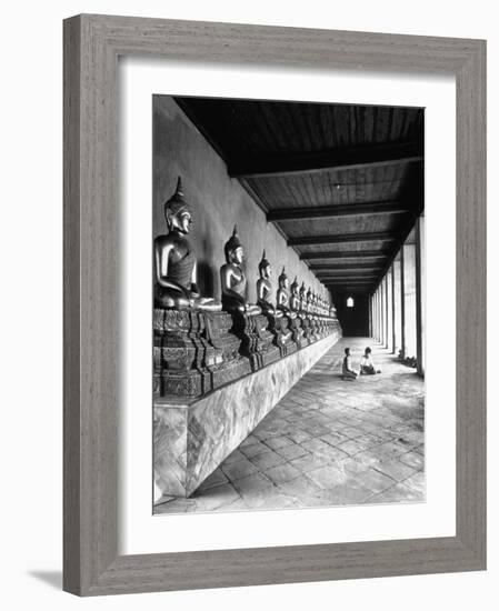 Young Buddhist and Boy on Inner Courtyard Near Buddhist Shrine-Dmitri Kessel-Framed Photographic Print