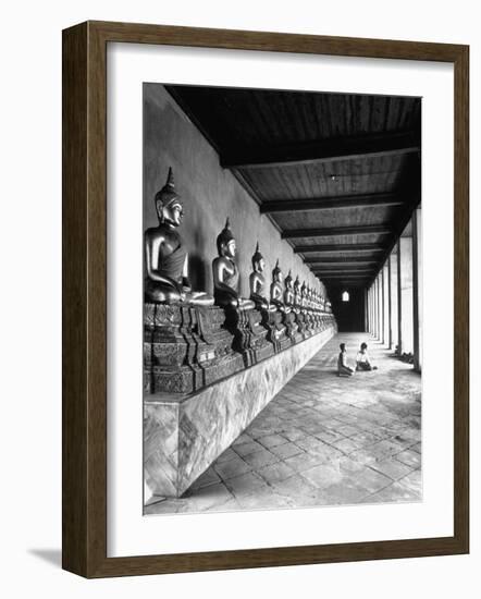 Young Buddhist and Boy on Inner Courtyard Near Buddhist Shrine-Dmitri Kessel-Framed Photographic Print