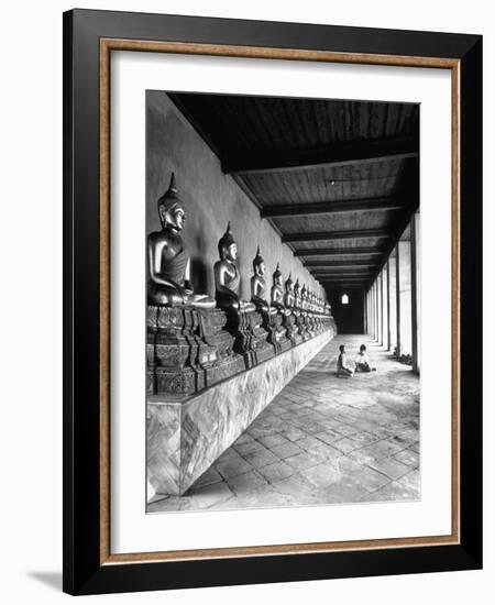 Young Buddhist and Boy on Inner Courtyard Near Buddhist Shrine-Dmitri Kessel-Framed Photographic Print