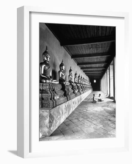 Young Buddhist and Boy on Inner Courtyard Near Buddhist Shrine-Dmitri Kessel-Framed Photographic Print