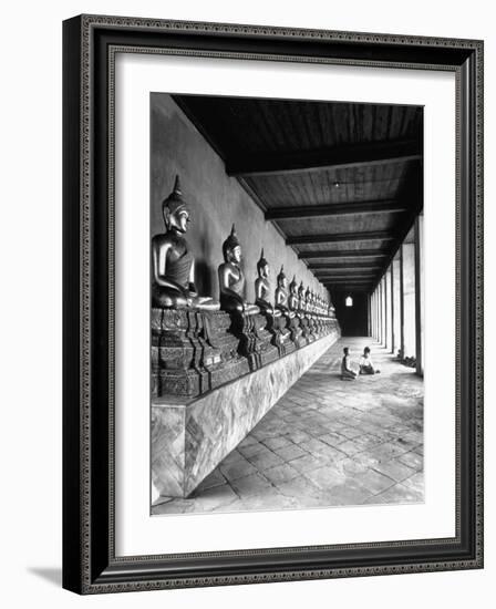 Young Buddhist and Boy on Inner Courtyard Near Buddhist Shrine-Dmitri Kessel-Framed Photographic Print