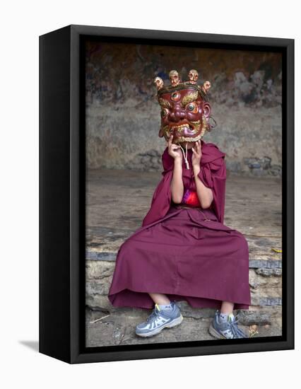 Young Buddhist Monk Holding Traditional Carved Wooden Mask to His Face at the Tamshing Phala Choepa-Lee Frost-Framed Premier Image Canvas