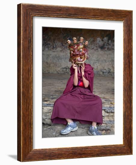 Young Buddhist Monk Holding Traditional Carved Wooden Mask to His Face at the Tamshing Phala Choepa-Lee Frost-Framed Photographic Print