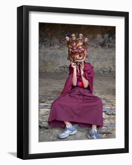 Young Buddhist Monk Holding Traditional Carved Wooden Mask to His Face at the Tamshing Phala Choepa-Lee Frost-Framed Photographic Print