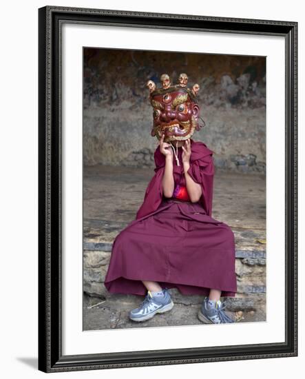 Young Buddhist Monk Holding Traditional Carved Wooden Mask to His Face at the Tamshing Phala Choepa-Lee Frost-Framed Photographic Print