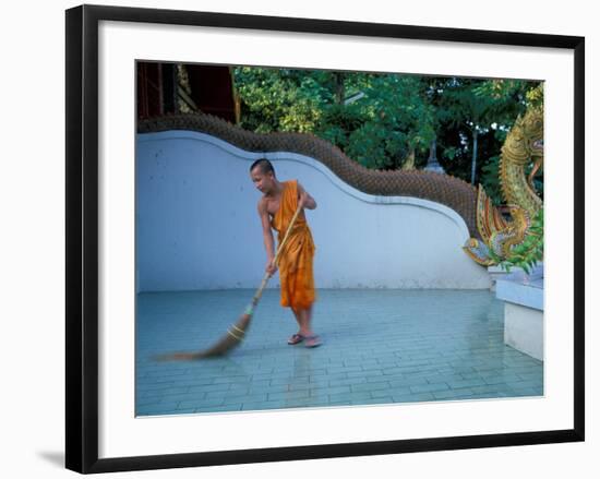 Young Buddhist Monk Sweeps Grounds at Wat Chaimong Khon Along Ping River at Sunset, Thailand-Paul Souders-Framed Photographic Print