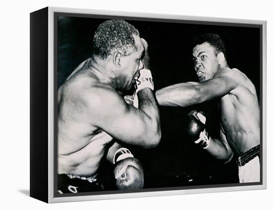 Young Cassius Clay Scores with a Left Against the Veteran Archie Moore in the First Round of the?-American Photographer-Framed Premier Image Canvas