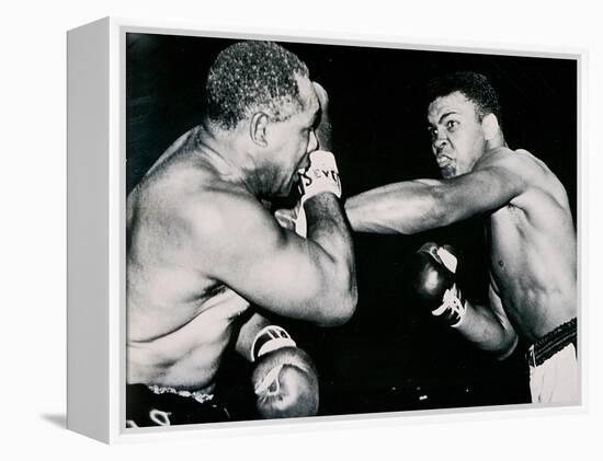 Young Cassius Clay Scores with a Left Against the Veteran Archie Moore in the First Round of the?-American Photographer-Framed Premier Image Canvas