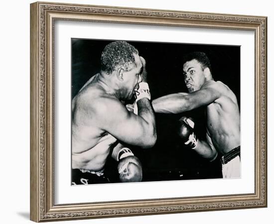 Young Cassius Clay Scores with a Left Against the Veteran Archie Moore in the First Round of the?-American Photographer-Framed Photographic Print