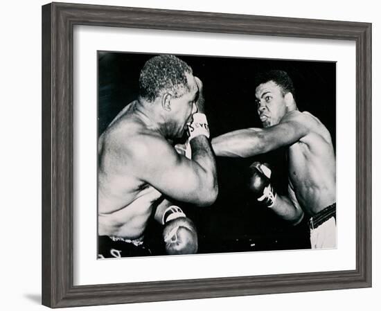 Young Cassius Clay Scores with a Left Against the Veteran Archie Moore in the First Round of the?-American Photographer-Framed Photographic Print