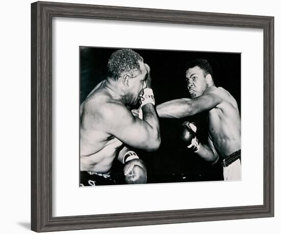 Young Cassius Clay Scores with a Left Against the Veteran Archie Moore in the First Round of the?-American Photographer-Framed Photographic Print