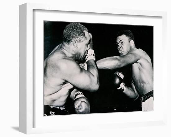 Young Cassius Clay Scores with a Left Against the Veteran Archie Moore in the First Round of the?-American Photographer-Framed Photographic Print