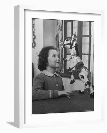 Young Child Starring at Marionette Muffin the Mule-William Sumits-Framed Photographic Print