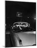 Young Couple Cuddling as They Watch a Movie at Drive in Theater-Francis Miller-Mounted Photographic Print