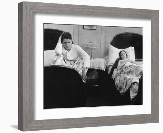 Young Couple in Separate Beds after Fight-null-Framed Photo