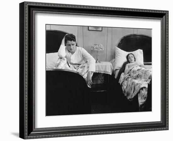 Young Couple in Separate Beds after Fight-null-Framed Photo