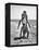 Young Couple Playing Leapfrog on the Beach-The Chelsea Collection-Framed Stretched Canvas