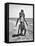 Young Couple Playing Leapfrog on the Beach-The Chelsea Collection-Framed Stretched Canvas