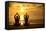 Young Couple Practicing Yoga On The Sea Beach At Sunset-De Visu-Framed Stretched Canvas