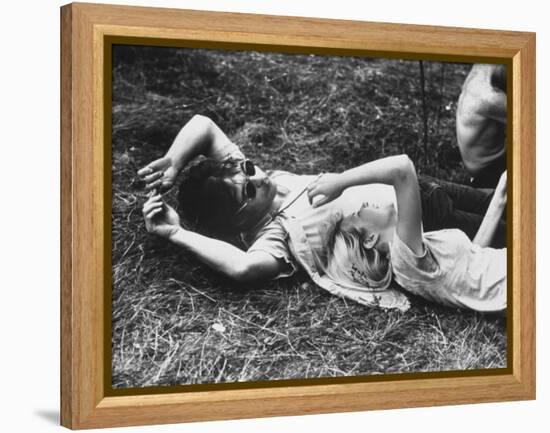 Young Couple Relaxing During Woodstock Music Festival-Bill Eppridge-Framed Premier Image Canvas