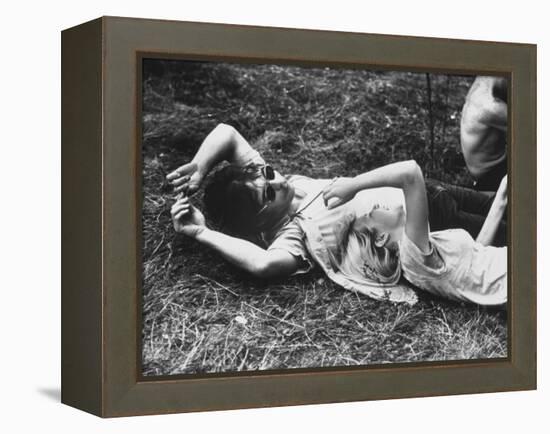 Young Couple Relaxing During Woodstock Music Festival-Bill Eppridge-Framed Premier Image Canvas