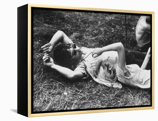 Young Couple Relaxing During Woodstock Music Festival-Bill Eppridge-Framed Premier Image Canvas