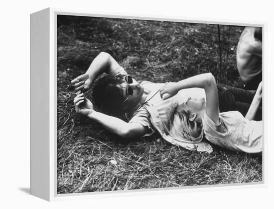 Young Couple Relaxing During Woodstock Music Festival-Bill Eppridge-Framed Premier Image Canvas