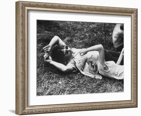 Young Couple Relaxing During Woodstock Music Festival-Bill Eppridge-Framed Photographic Print