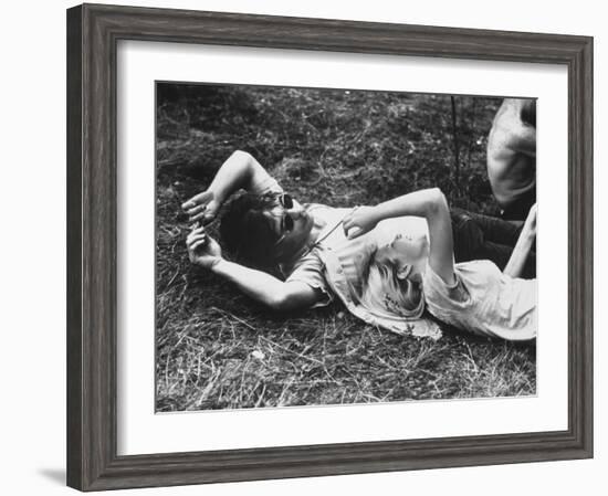 Young Couple Relaxing During Woodstock Music Festival-Bill Eppridge-Framed Photographic Print