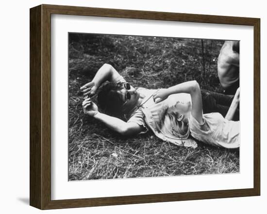 Young Couple Relaxing During Woodstock Music Festival-Bill Eppridge-Framed Photographic Print