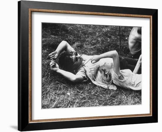 Young Couple Relaxing During Woodstock Music Festival-Bill Eppridge-Framed Photographic Print