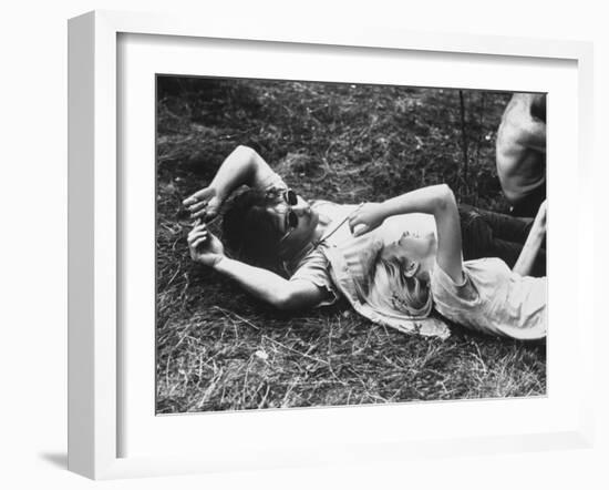 Young Couple Relaxing During Woodstock Music Festival-Bill Eppridge-Framed Photographic Print