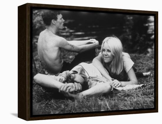 Young Couple Relaxing During Woodstock Music Festival-null-Framed Premier Image Canvas