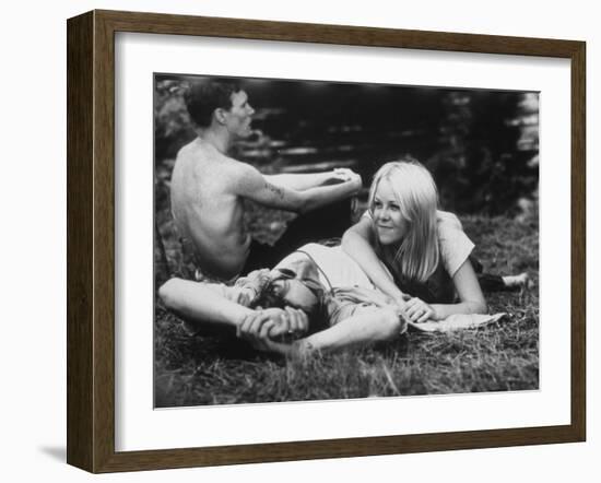 Young Couple Relaxing During Woodstock Music Festival-null-Framed Photographic Print