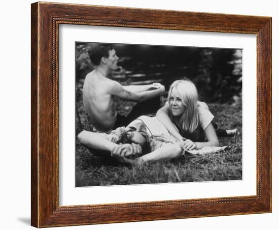 Young Couple Relaxing During Woodstock Music Festival-null-Framed Photographic Print