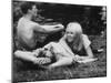 Young Couple Relaxing During Woodstock Music Festival-null-Mounted Photographic Print