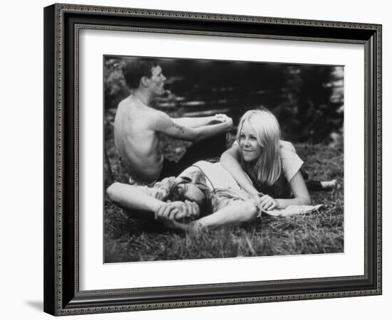 Young Couple Relaxing During Woodstock Music Festival-null-Framed Photographic Print