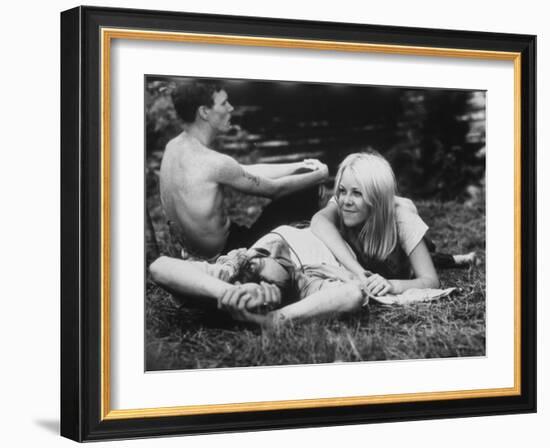 Young Couple Relaxing During Woodstock Music Festival-null-Framed Photographic Print