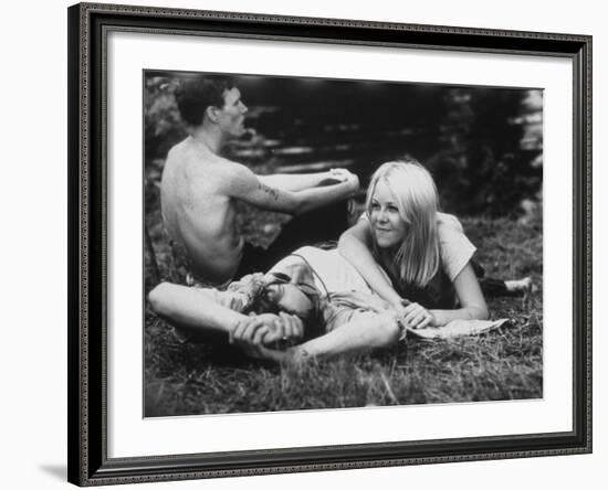 Young Couple Relaxing During Woodstock Music Festival-null-Framed Photographic Print