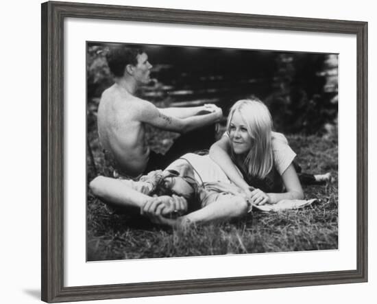 Young Couple Relaxing During Woodstock Music Festival-null-Framed Photographic Print