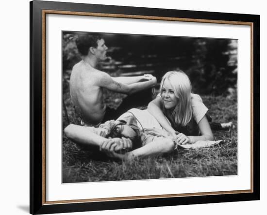 Young Couple Relaxing During Woodstock Music Festival-null-Framed Photographic Print