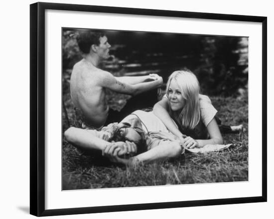 Young Couple Relaxing During Woodstock Music Festival-null-Framed Photographic Print