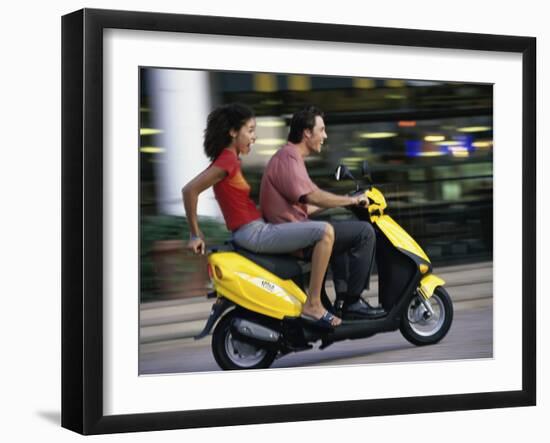 Young Couple Riding on a Motor Scooter-null-Framed Photographic Print