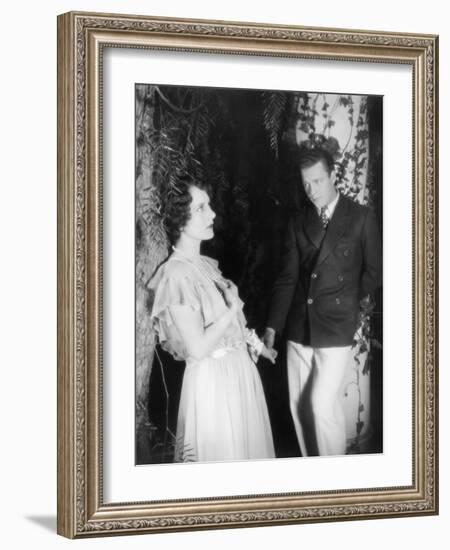 Young Couple Standing Together and Holding Hands-null-Framed Photo