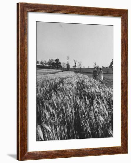 Young Couple Walking by a Grain Field-Ed Clark-Framed Photographic Print